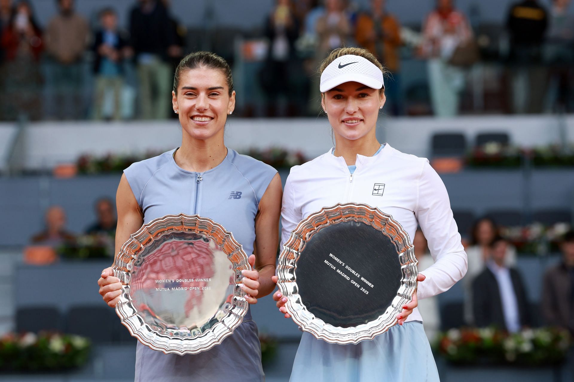 Anna Kalinskaya and Sorana Cirstea celebrate after winning the women's doubles title at the Madrid Open. Source: Getty